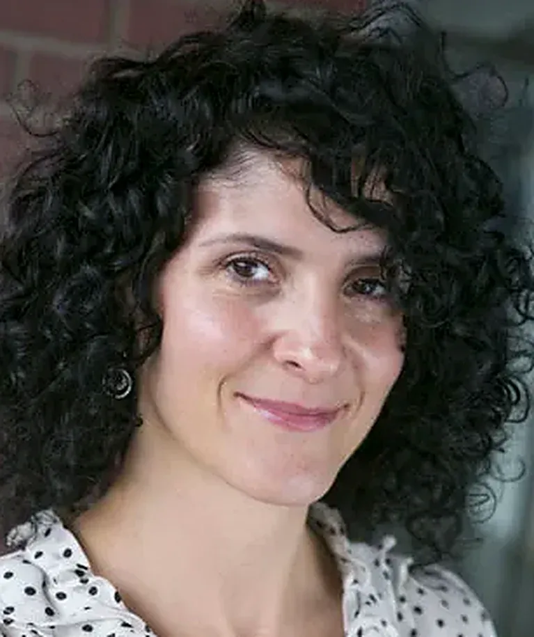 Dr. A. Corinne Xidos